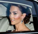 <p>Kate Middleton heads to Buckingham Palace wearing the Lover's Knot Tiara, the Queen Mother's Sapphire and Diamond Fringe Earrings, and what appears to be a white gown.</p>