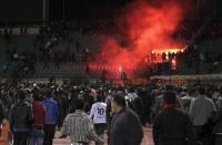 Soccer fans flee from a fire at Port Said Stadium February 1, 2012. REUTERS/Stringer