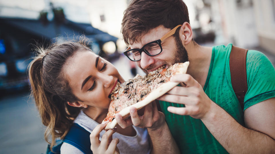 friends taste testing pizza for money