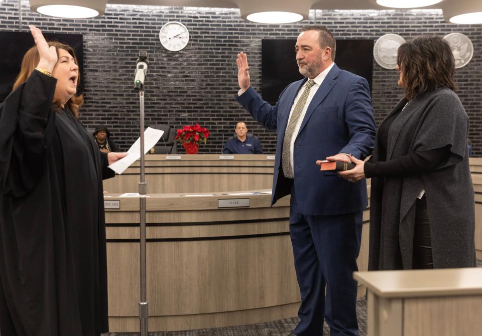 Canton's new mayor, William Sherer II, is sworn in Thursday by Stark County Common Pleas Judge Taryn Heath. Next to Sherer is his wife, Carrie.