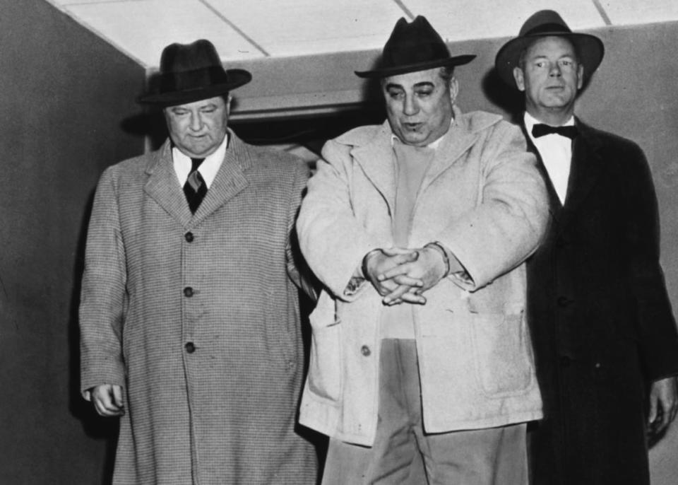 <div class="inline-image__caption"><p>Anthony Pino, 48, is taken from the local FBI headquarters for arraignment in 1956 in connection with the Brink's robbery.</p></div> <div class="inline-image__credit">Bettmann/Getty Images</div>