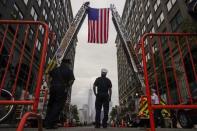 Jersey City firefighters attend a ceremony at the 9/11 memorial during the 13th anniversary of the 9/11 attacks on the World Trade Center, in Exchange Place, New Jersey, September 11, 2014. REUTERS/Eduardo Munoz