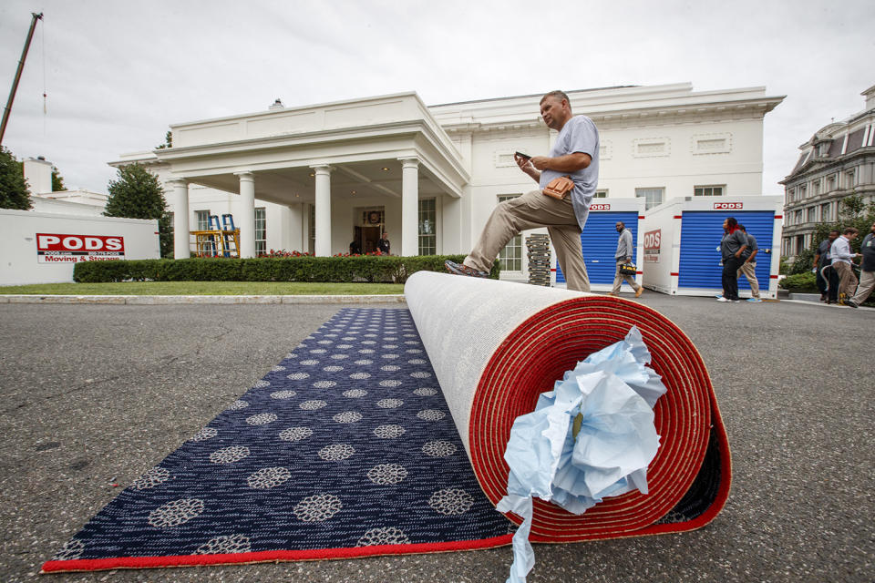 <p>Workmen prepare new carpeting for the West Wing of the White House in Washington, Friday, Aug. 11, 2017, as it undergoes renovations while President Donald Trump is spending time at his golf resort in New Jersey. (AP Photo/J. Scott Applewhite) </p>