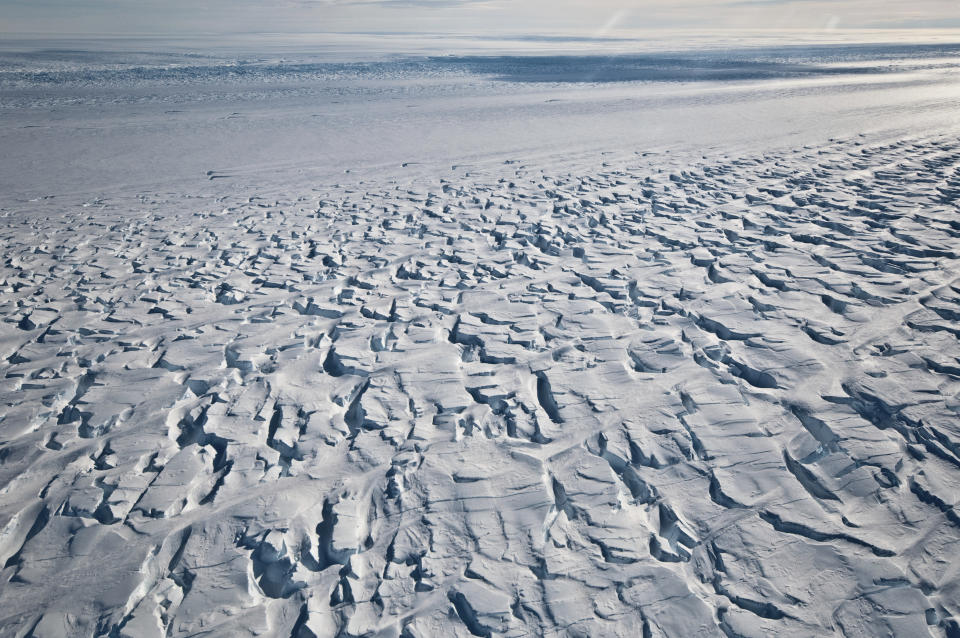 This January 2010 photo provided by Ian Joughin shows the area near the grounding line of the Pine Island Glacier along its west side in Antarctica. According to a study published in the Friday, June 11, 2021 issue of Science Advances, the critical Antarctic glacier is looking more vulnerable as satellite images show the ice shelf that blocks it from collapsing into the sea is breaking up much faster than before and spawning huge icebergs. (Ian Joughin via AP)