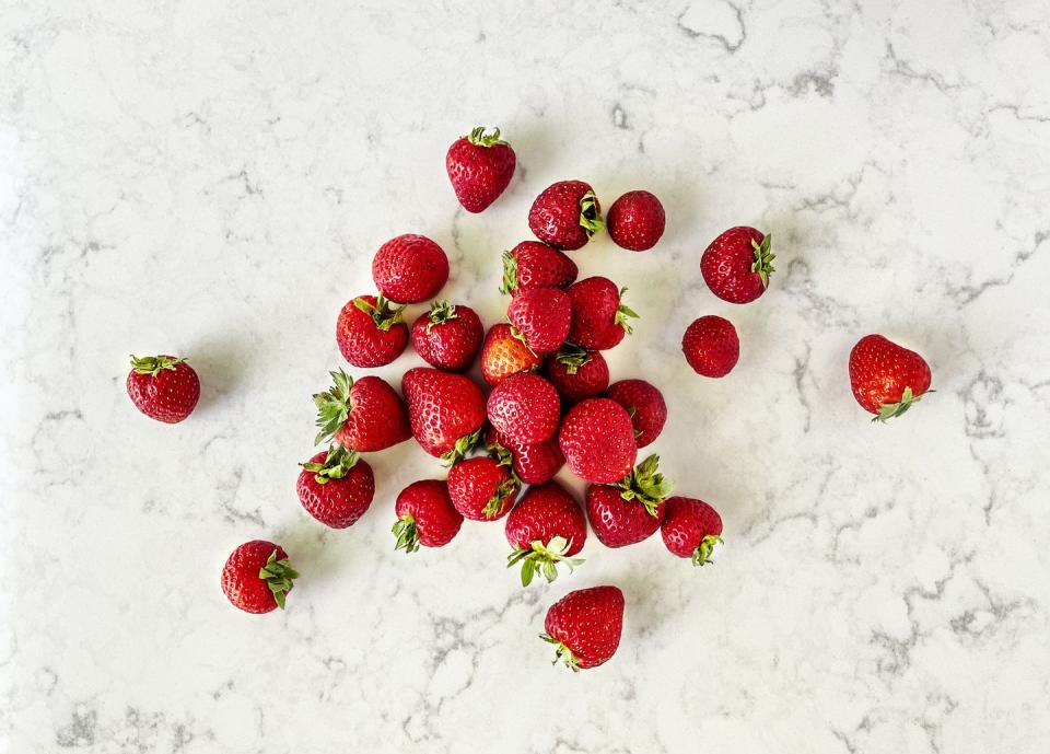 strawberries on white marble background
