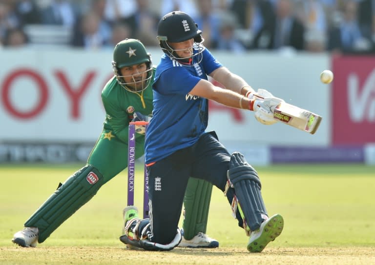 England's Joe Root (R) plays a shot watches by Pakistan's wicket-keeper Sarfraz Ahmed during play in the second one day international (ODI) cricket match between England and Pakistan at Lord's cricket ground in London on August 27, 2016