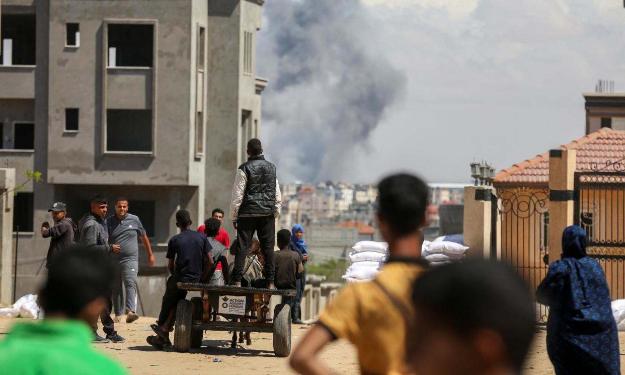 <span>Smoke rises after an Israeli strike on Rafah on Monday.</span><span>Photograph: Hatem Khaled/Reuters</span>