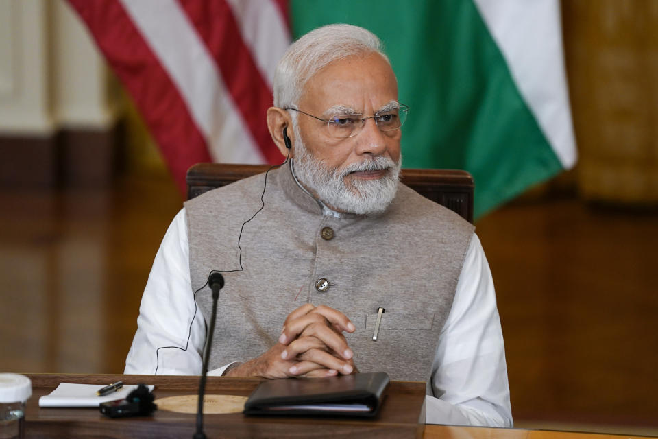 India's Prime Minister Narendra Modi listens during a meeting with President Joe Biden and American and Indian business leaders in the East Room of the White House, Friday, June 23, 2023, in Washington. (AP Photo/Evan Vucci)