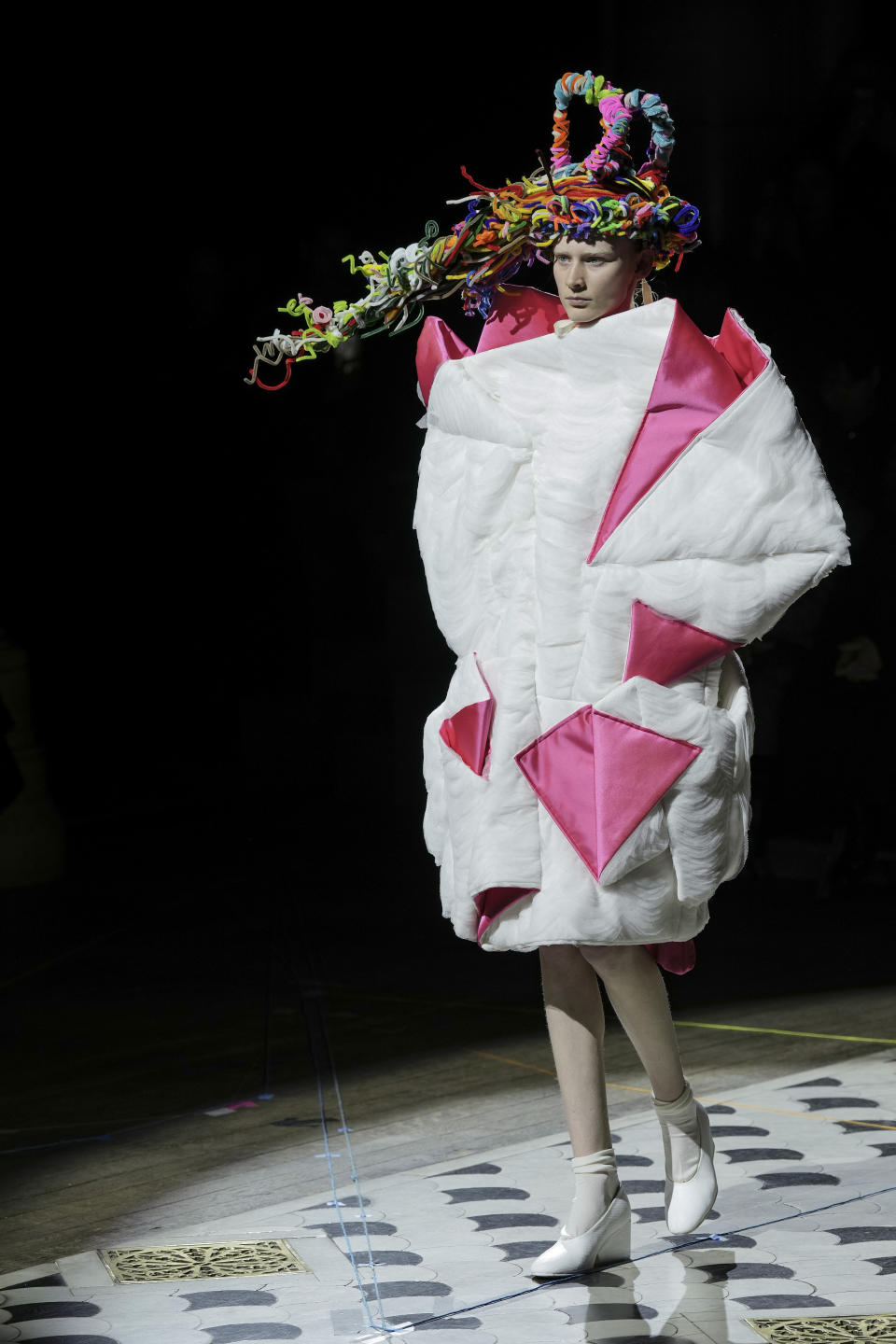 A model wears a creation as part of the Comme des Garcons Fall/Winter 2023-2024 ready-to-wear collection presented Saturday, March 4, 2023 in Paris. (Scott Garfitt/Invision/AP)