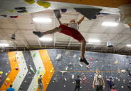 Drew Ruana, 16, a competitive climbing national champion, trains at Stone Gardens rock climbing gym in Bellevue, Washington October 20, 2015. REUTERS/Jason Redmond