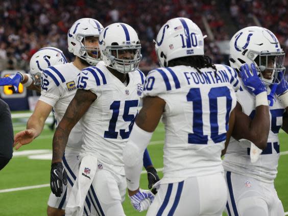 Dontrelle Inman (15) celebrates with teammates iafter a touchdown against the Houston Texans (Reuters)