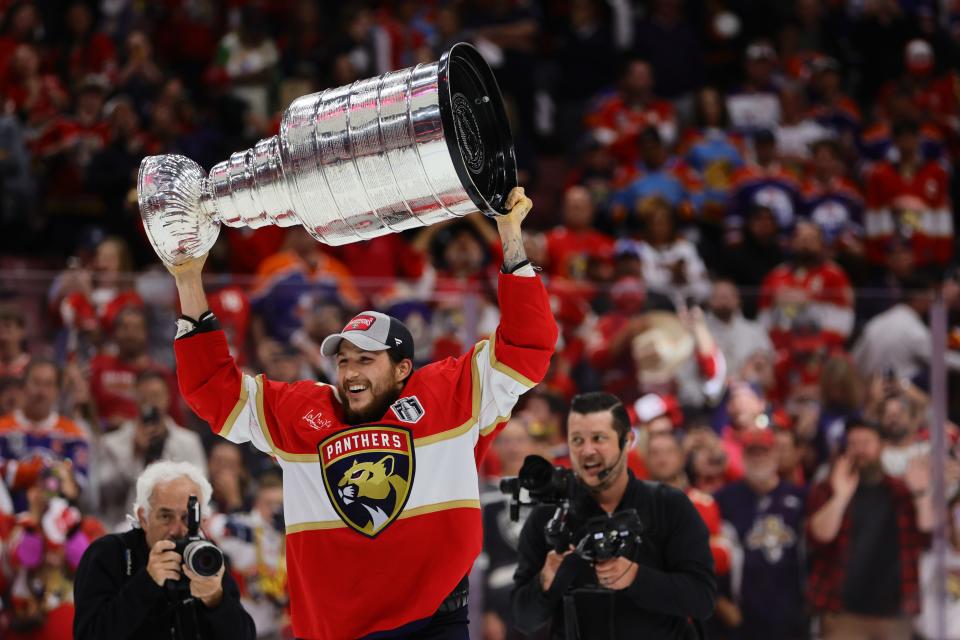 Florida Panthers forward Sam Reinhart (13) hoists the Stanley Cup after defeating the Edmonton Oilers in Game 7.