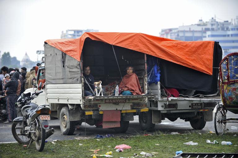 People rest in temporary shelter in open areas in Kathmandu