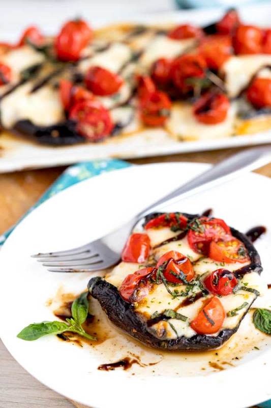 <p>Lemon Blossoms</p><p>Portobello mushrooms bathed in a simple balsamic herb marinade, topped with fresh mozzarella cheese, cherry tomatoes and basil and grilled to perfection. </p><p><strong>Get the recipe:</strong><a href="https://www.lemonblossoms.com/blog/grilled-portobello-mushrooms-caprese/" rel="nofollow noopener" target="_blank" data-ylk="slk:Grilled Portobello Mushrooms Caprese;elm:context_link;itc:0;sec:content-canvas" class="link "> <strong>Grilled Portobello Mushrooms Caprese</strong></a></p>