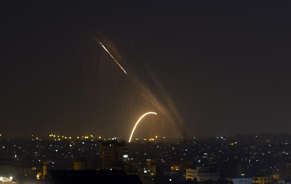 Rockets are launched from the Gaza Strip towards Israel, Wednesday, Nov. 13, 2019. Israeli aircraft have struck Islamic Jihad targets throughout the Gaza Strip while the militant group rained scores of rockets into Israel for a second straight day as the heaviest round of fighting in months showed no signs of ending. (AP Photo/Khalil Hamra)