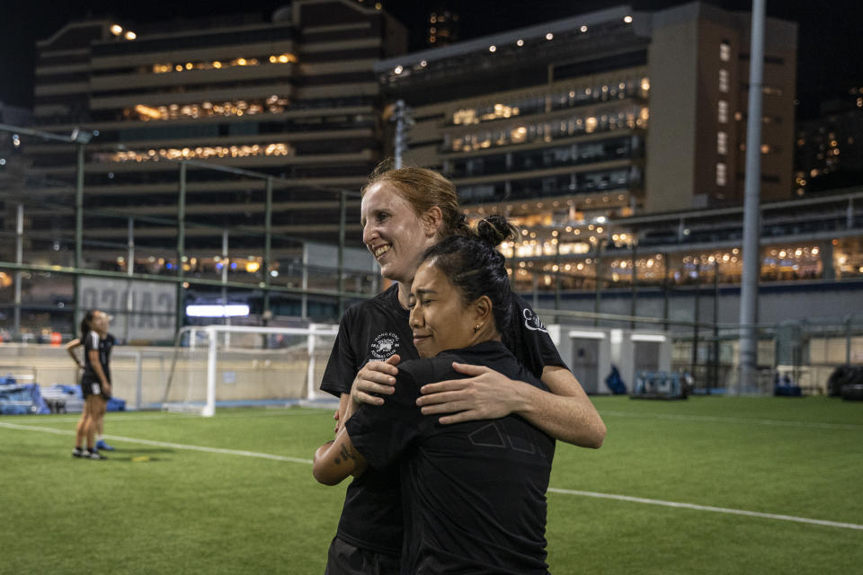 Members of the women's seven-a-side team react during training in Happy Valley ahead of the Gay Games in Hong Kong, Tuesday, Oct. 31, 2023. Set to launch on Friday, Nov. 3, 2023, the first Gay Games in Asia are fostering hopes for wider LGBTQ+ inclusion in the Asian financial hub. (AP Photo/Chan Long Hei)