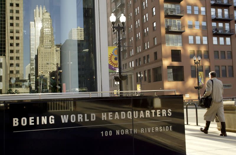 FILE PHOTO: Pedestrian walks past Boeing World Headquarters office building in Chicago