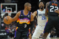 Phoenix Suns guard Chris Paul (3) looks to pass against the Dallas Mavericks during the first half of Game 7 of an NBA basketball Western Conference playoff semifinal, Sunday, May 15, 2022, in Phoenix. (AP Photo/Matt York)