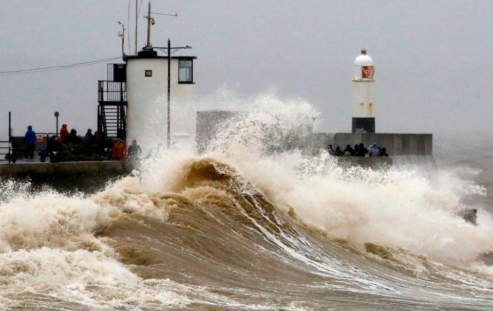 Huge waves crash against the sea wall at Porthcawl, south Wales as Storm Dennis hits the country on February 15, 2020. As Storm Dennis sweeps in, the country is bracing itself for widespread weather disruption for the second weekend in a row. Experts have warned that conditions amount to a "perfect storm", with hundreds of homes at risk of flooding.