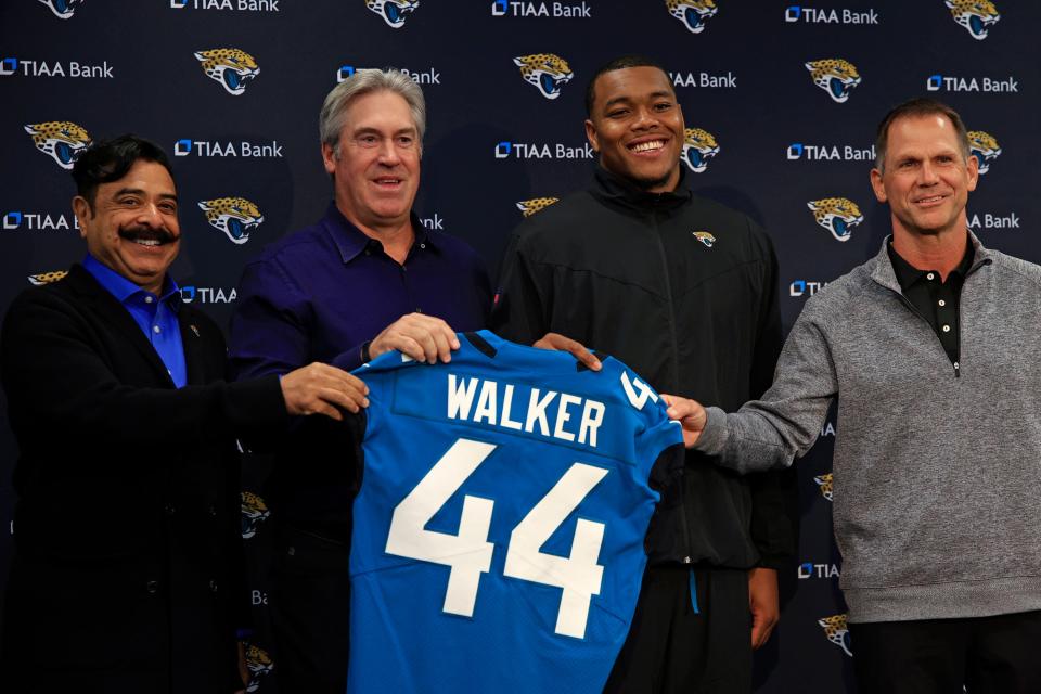 Jacksonville Jaguars owner Shad Khan, from left, head coach Doug Pederson, first round draft pick Travon Walker, and Jacksonville Jaguars General Manager Trent Baalke hold to be photographed during a press conference Friday, April 29, 2022 at TIAA Bank Field in Jacksonville. Walker, a defensive lineman from the University of Georgia, was the overall No. 1 pick for the Jacksonville Jaguars in the 2022 NFL Draft. 