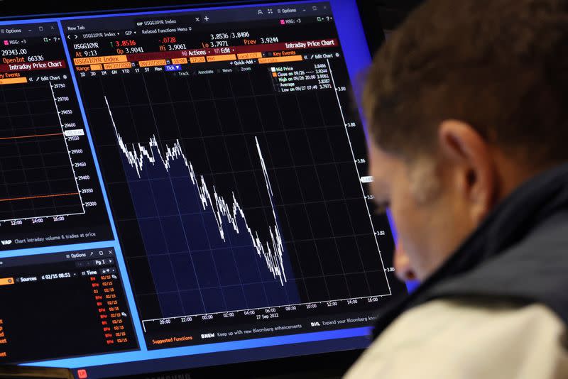 Traders work on the floor of the NYSE in New York