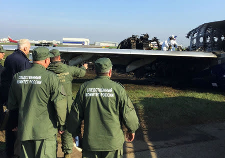 Chairman of Russia's Investigative Committee Alexander Bastrykin (2n L) visits the scene of an incident involving an Aeroflot Sukhoi Superjet 100 passenger plane at Moscow's Sheremetyevo airport, Russia May 6, 2019. The Investigative Committee of the Russian Federation/Handout via REUTERS