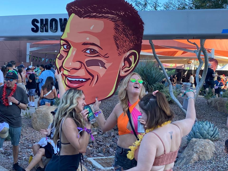Attendees party with a Gronk big head at Gronk Beach.