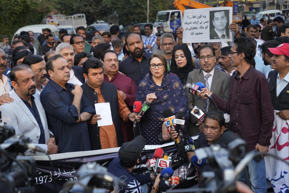 Journalists and members of civil society hold a demonstration to condemn the killing of a senior Pakistani journalist Arshad Sharif by Kenyan police, in Lahore, Pakistan, Monday, Oct. 24, 2022. Sharif, 50, had been in hiding abroad after leaving Pakistan to avoid arrest on charges of criticizing his country's powerful military. He was shot and killed by police after the car he was in sped up instead of halting at a roadblock near Nairobi, the police said. The police said it was a case of "mistaken identity" during a search for a similar car involved in a case of child abduction. (AP Photo/K.M. Chaudary)