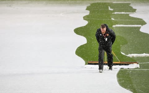 Man Utd clearing the pitch - Credit: OFFSIDE