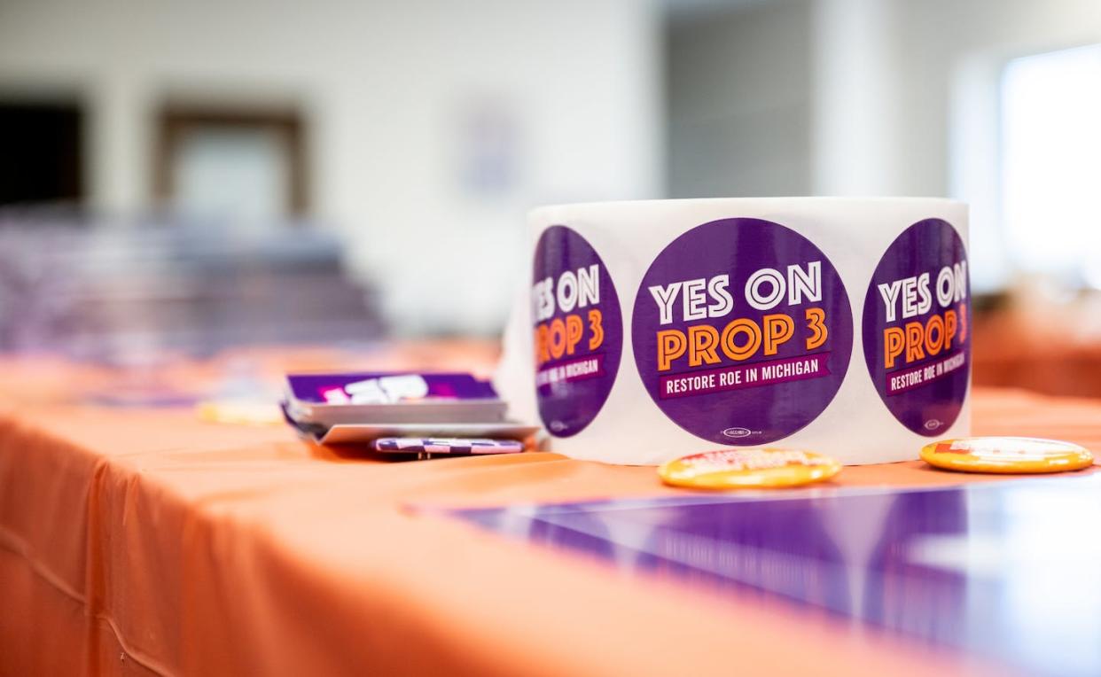 Voters in Michigan said 'yes' to Prop 3, a ballot protecting abortion rights. <a href="https://www.gettyimages.com/detail/news-photo/proposal-3-stickers-are-displayed-for-volunteers-at-the-news-photo/1439552294?phrase=abortion%20midterm&adppopup=true" rel="nofollow noopener" target="_blank" data-ylk="slk:Brandon Bell/Getty Images;elm:context_link;itc:0;sec:content-canvas" class="link ">Brandon Bell/Getty Images</a>