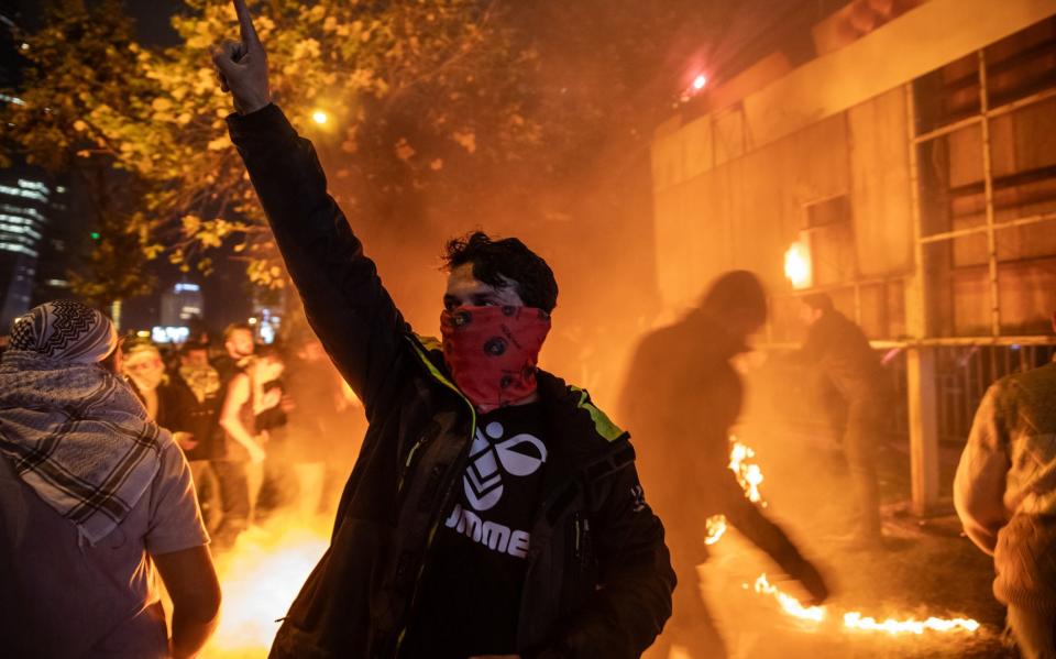 Protesters demonstrate in front of the Israeli Consulate after an explosion at a hospital in Gaza killed hundreds on October 17, 2023 in Istanbul, Turkey