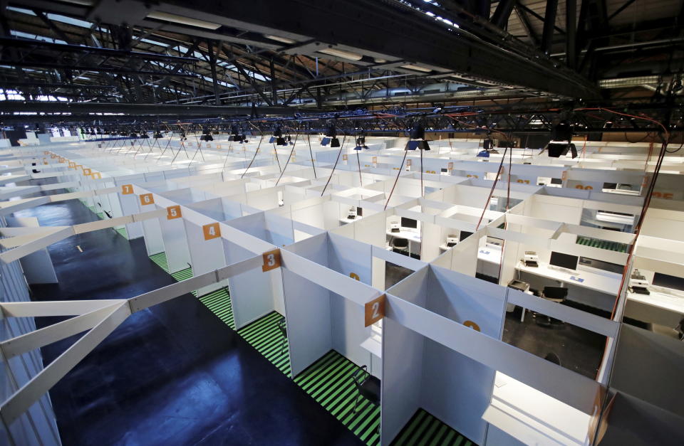 View of the vaccination booths of the new vaccination center in the Arena Berlin in Berlin, Germany, Monday, Dec. 21, 2020. (Hannibal Hanschke/Pool via AP)