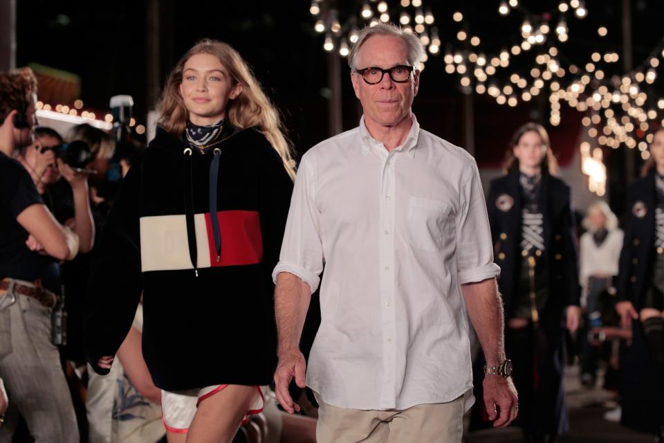 Designer Tommy Hilfiger and model Gigi Hadid walk the runway at #TOMMYNOW Women's Fashion Show during New York Fashion Week earlier this year. (Photo: Getty Images)