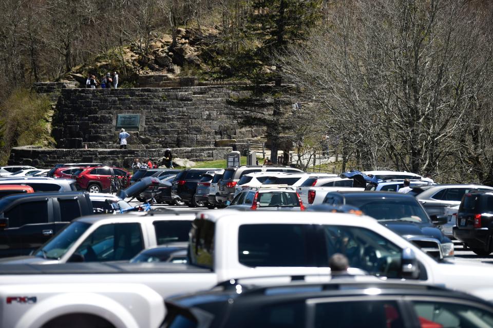 Cars fill the Newfound Gap parking lot in the Great Smoky Mountains National Park in May 2020. A daily fee of $5 will start March 1 for anyone parking inside the park.