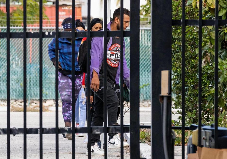 A group of Cuban migrants enter the U.S. Customs and Border Protection office on Sunday, Jan. 8, 2023, in Marathon, Fla.