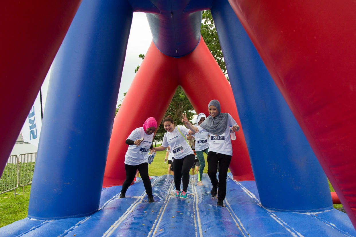 Participants negotiating an obstacle during the Skechers Friendship Walk 2018 at Gardens by the Bay East on 1 December, 2018. (PHOTO: Skechers Singapore)