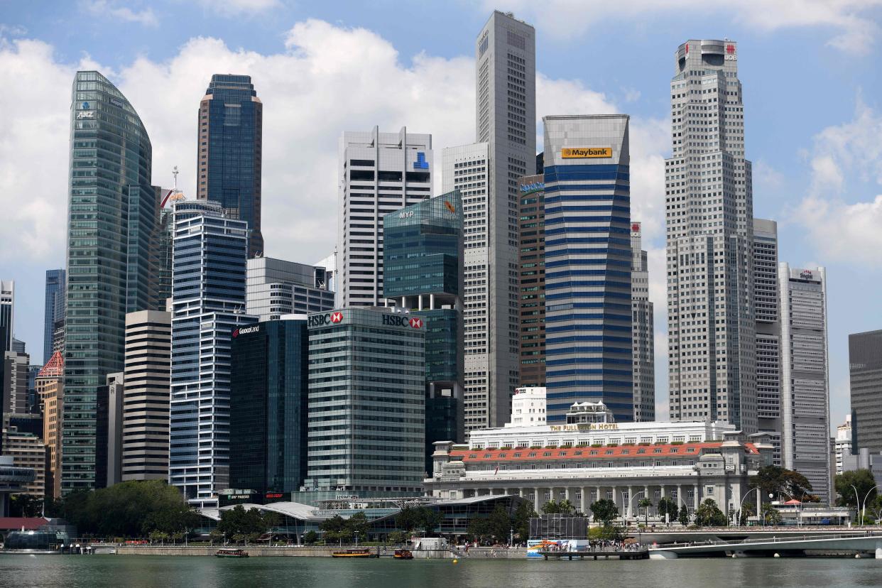 A general view shows the financial business district in Singapore on March 19, 2019. - Paris has climbed to the top of the world's priciest city for expatriates, tied first with Singapore and Hong Kong according to a survey on March 19 that named the capital of strife-torn Venezuela as the cheapest. (Photo by Roslan RAHMAN / AFP)        (Photo credit should read ROSLAN RAHMAN/AFP via Getty Images)