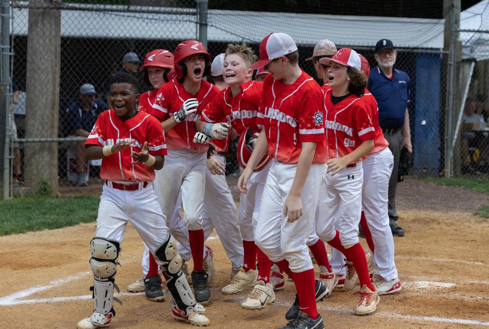 Holbrook Dylan Johnson celebrates as he hits a three run homer in the fourth inning. Holbrook Little League defeats Lincroft 5-0 in Sectional Tournament in Yardville, NJ on July 14, 2023. 
