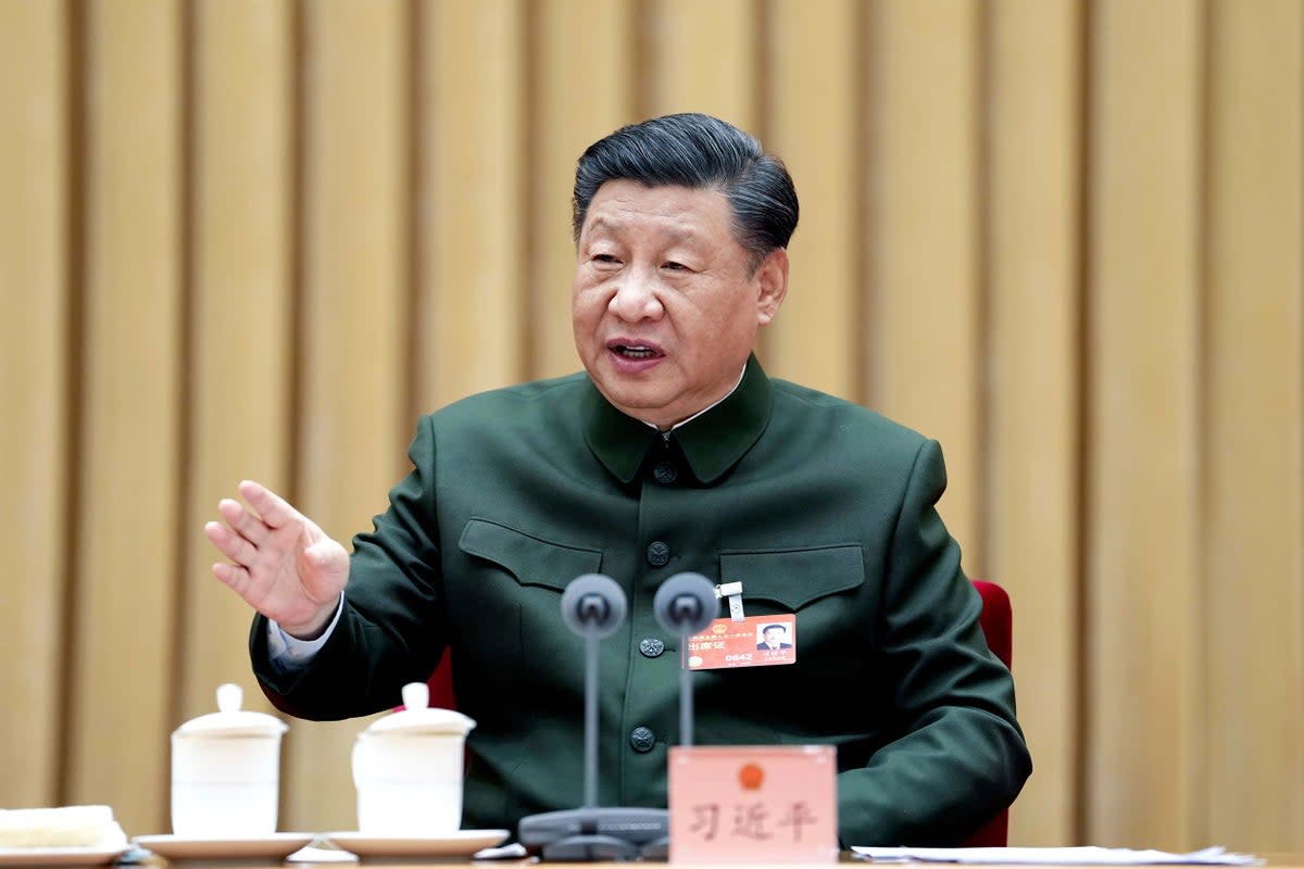 In this photo released by Xinhua News Agency, Chinese president Xi Jinping attends a plenary meeting of the delegation of the People's Liberation Army (PLA) and the People's Armed Police Force during the first session of the 14th National People's Congress (NPC) in Beijing, on Wednesday, 8 March 2023 (via AP)