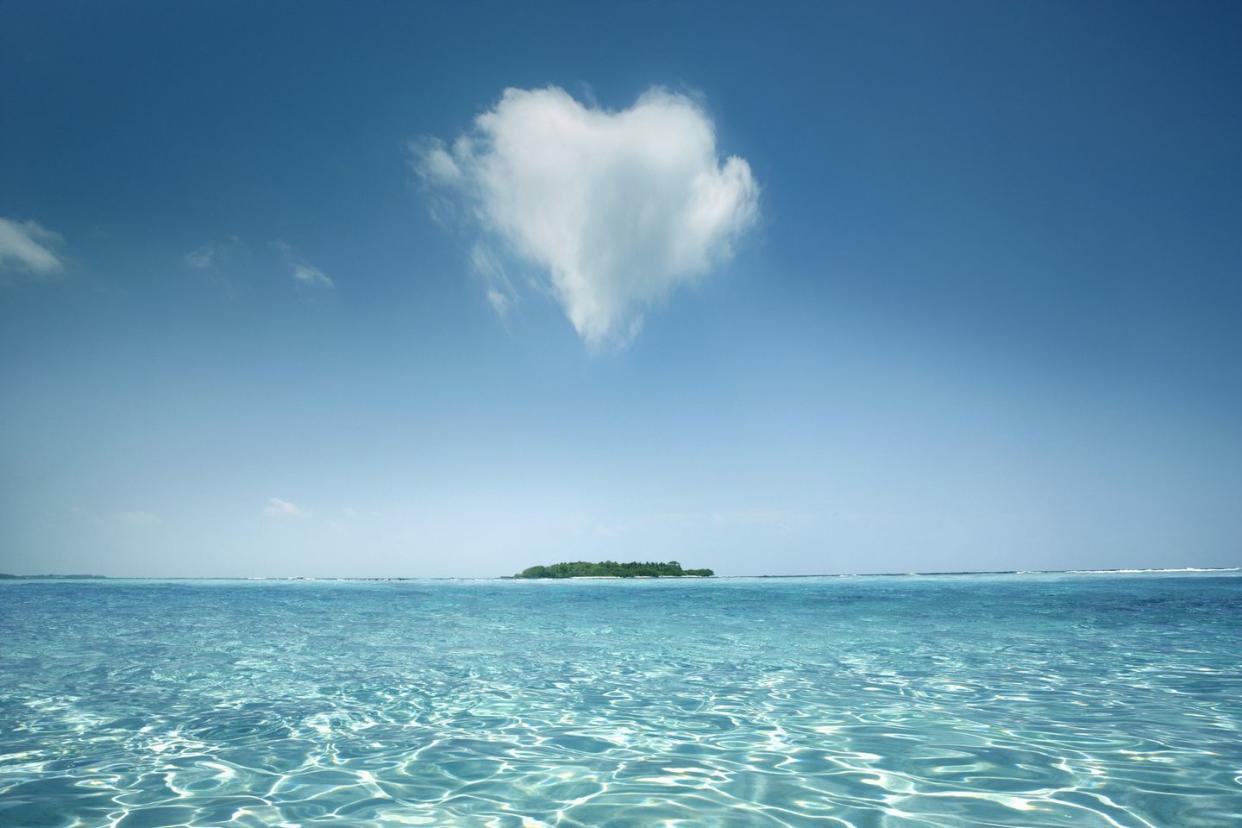 june holidays world oceans day heart shaped cloud over tropical waters