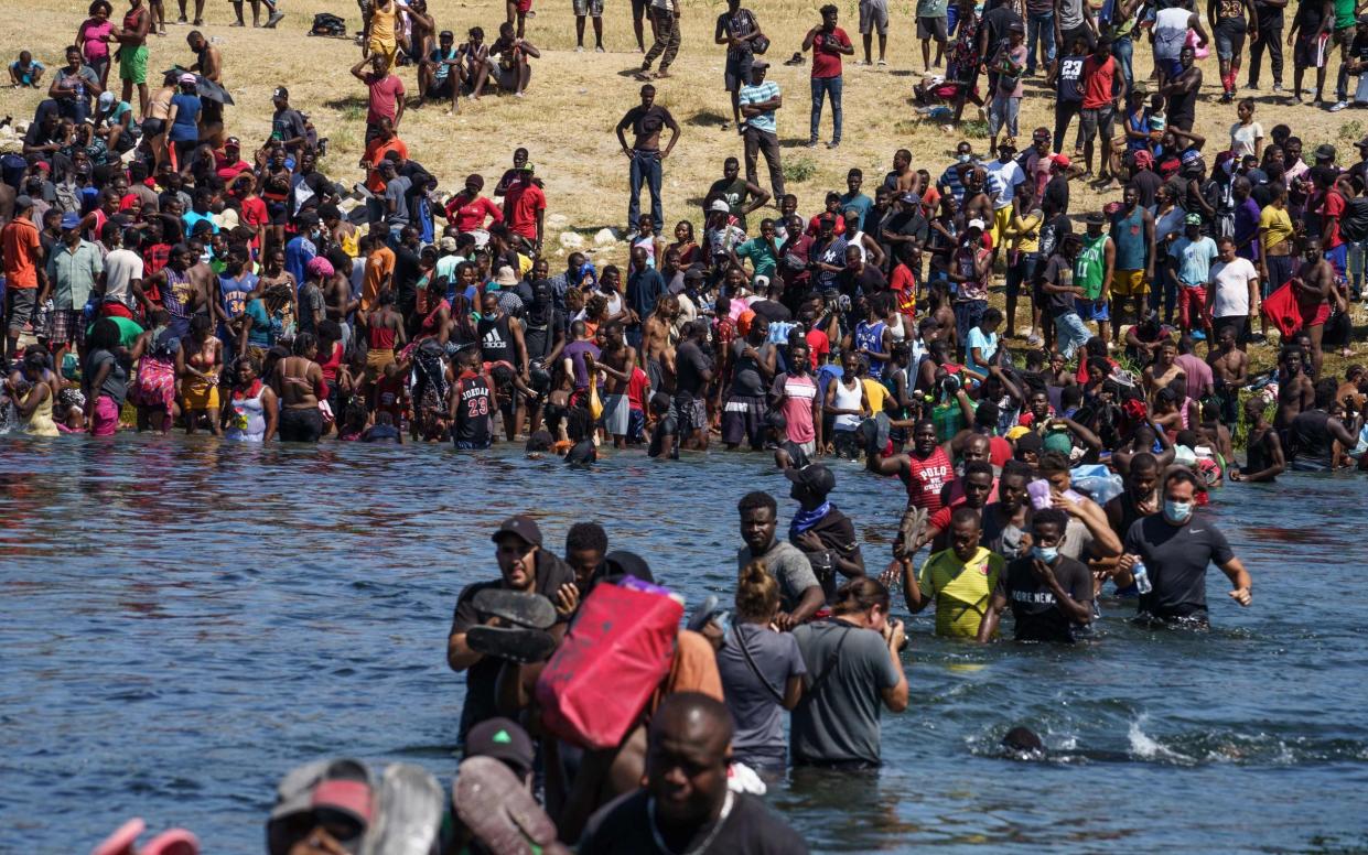 Haitian migrants cross the Rio Grande in 2021