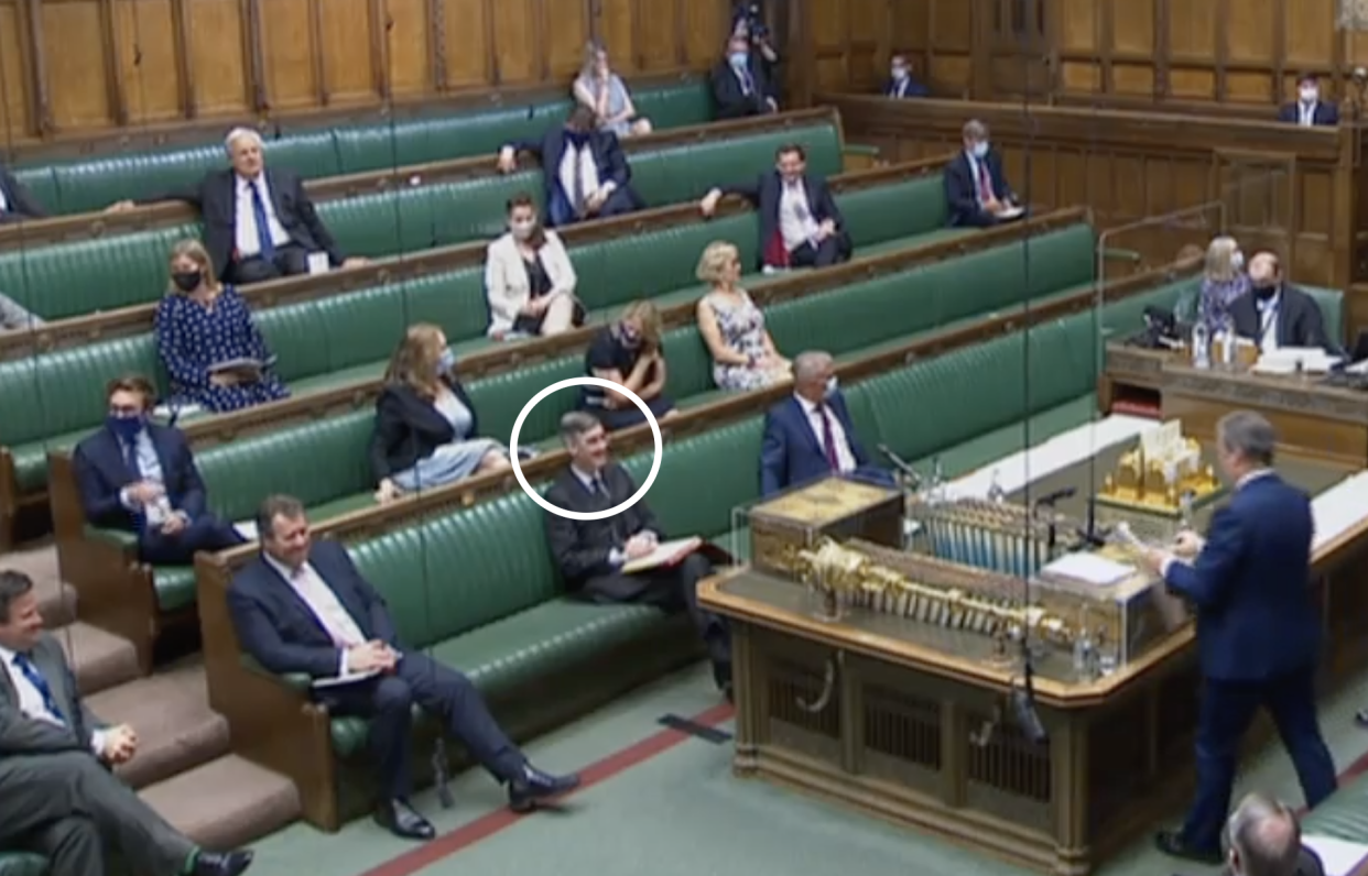 Jacob Rees-Mogg, circled, did not wear a face mask during PMQs on Wednesday. (Parliamentlive.tv)