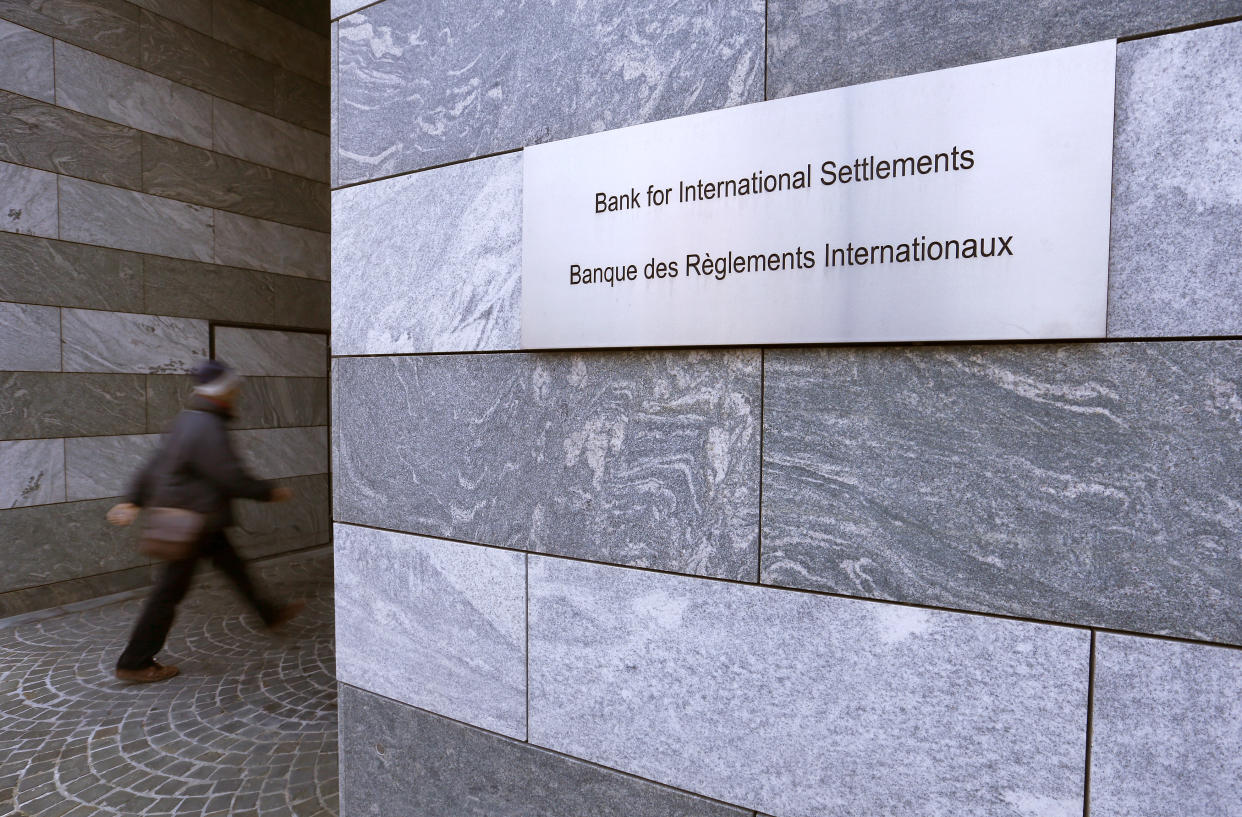 A man enters the Bank for International Settlements (BIS) in Basel December 5, 2013. REUTERS/Arnd Wiegmann (SWITZERLAND - Tags: BUSINESS)