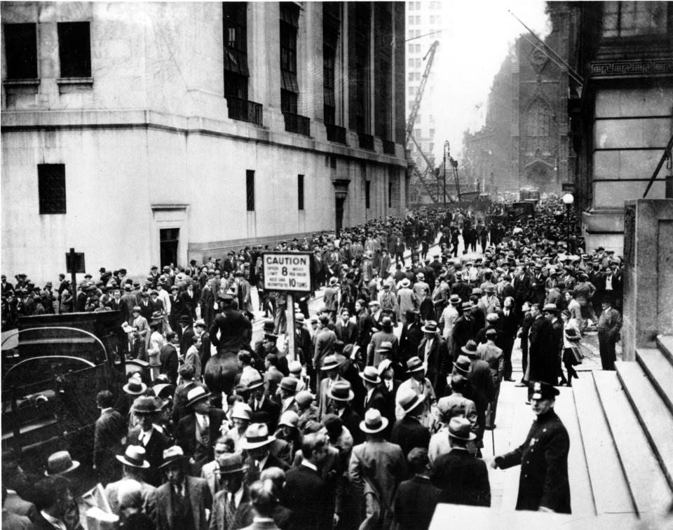 Crowds panic in the Wall Street district of Manhattan due to the heavy trading on the stock market in New York City on Oct. 24, 1929.  (AP Photo)