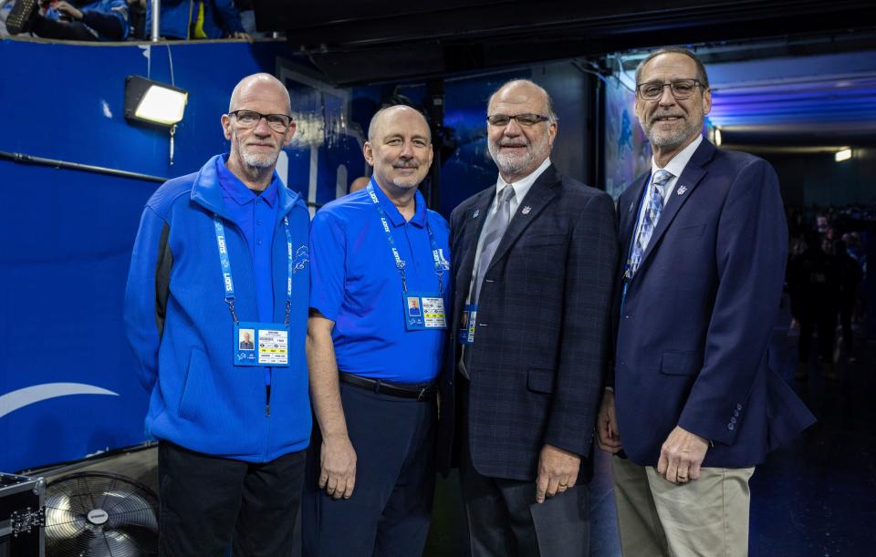 From left to right: Employees for the Detroit Lions Dave Cook, Paul Mrozinski, Art Wahl, and Scott Kelsey stand at the entrance of the tunnel during the final game of the season against the Minnesota Vikings at Ford Field in Detroit on Sunday, Jan. 7, 2024.