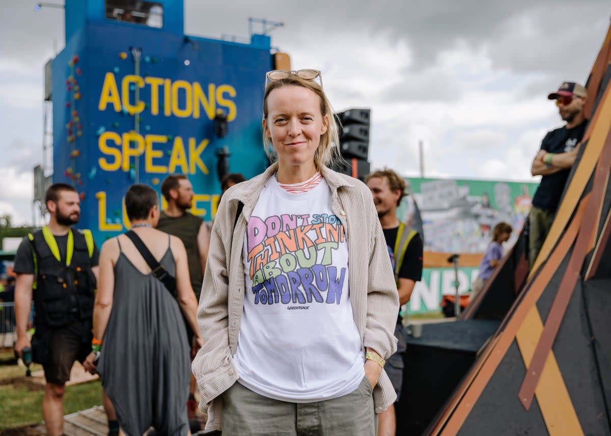 Emily Eavis wearing a Greenpeace ‘Don’t Stop Thinking About Tomorrow’ T-shirt at Glastonbury 2023 (Marie Jacquemin/Greenpeace)