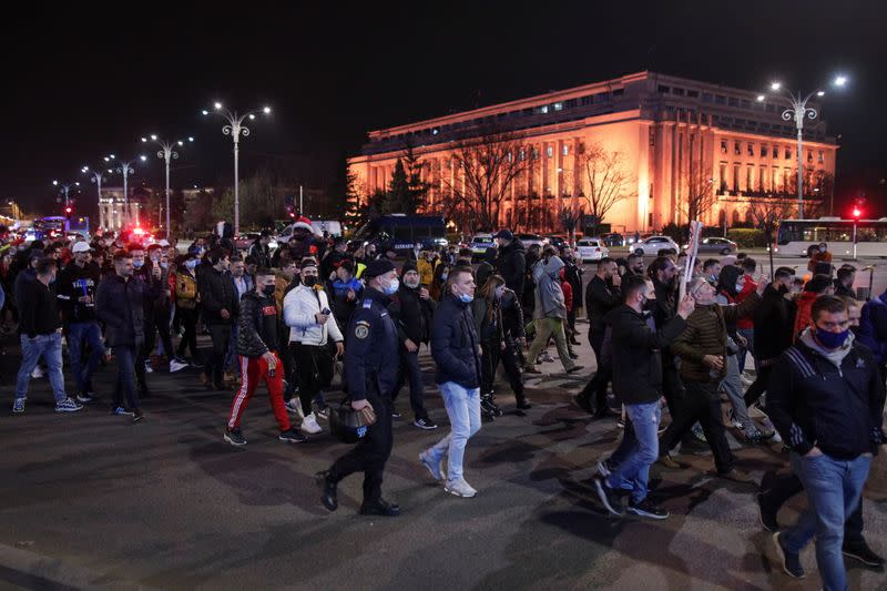 People march in downtown Bucharest demanding an end to coronavirus restrictions