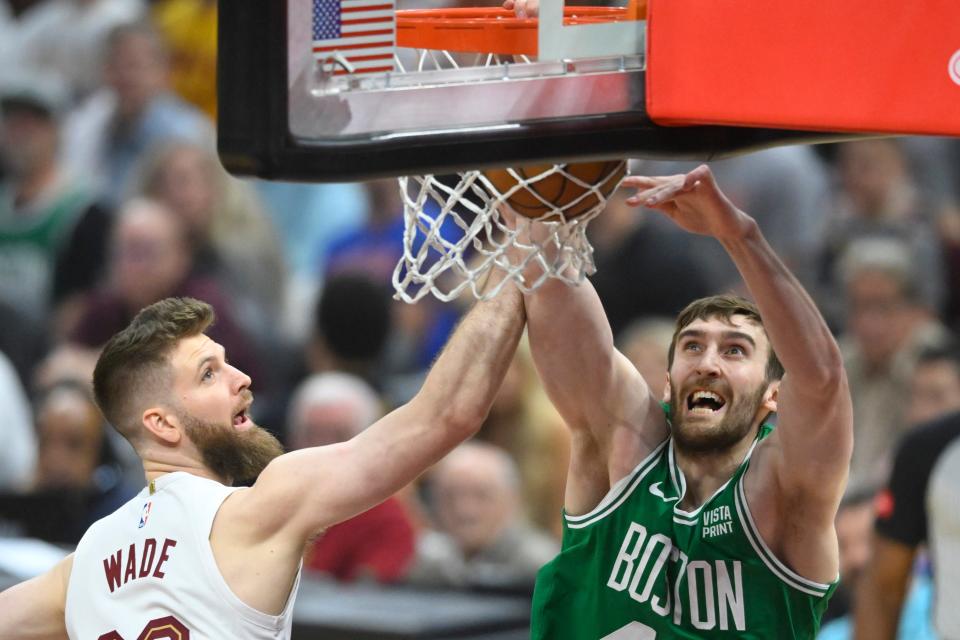 Celtics center Luke Kornet dunks over Cavaliers forward Dean Wade in the first quarter of Game 4 of the Eastern Conference semifinals, May 13, 2024, in Cleveland.