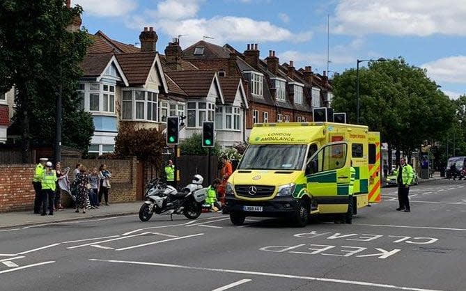 The scene on the Upper Richmond Rd, Richmond London where a police bike, part of a Royal convoy, hit 84 year old Irene Mayor - Simon Banks - The Sun