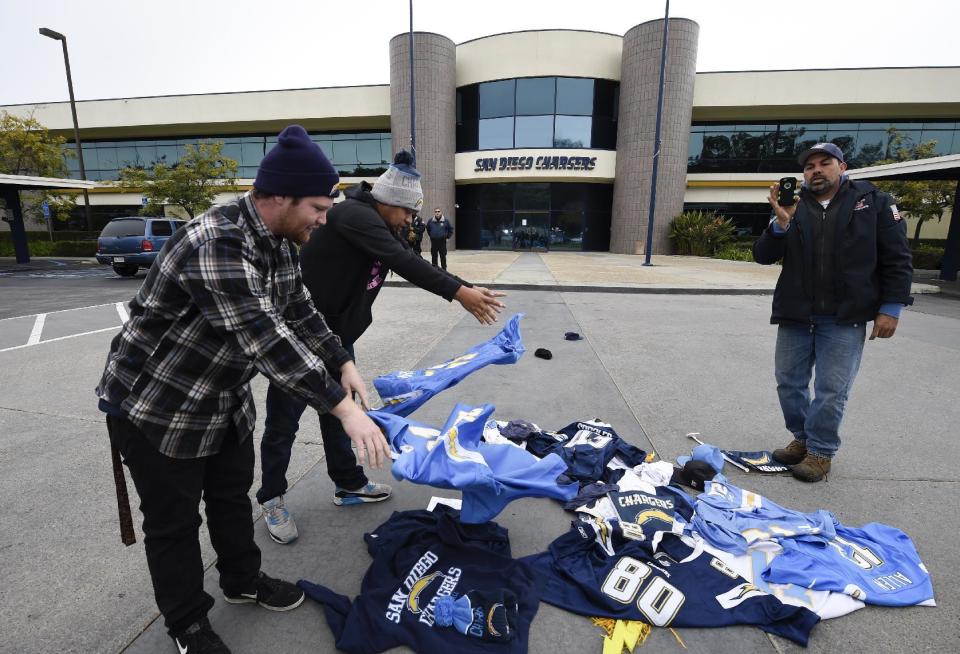 Former San Diego Chargers fans throw down Chargers jerseys in front of Chargers headquarters after the team announced that it will move to Los Angeles Thursday, Jan. 12, 2017, in San Diego. (AP Photo/Denis Poroy)